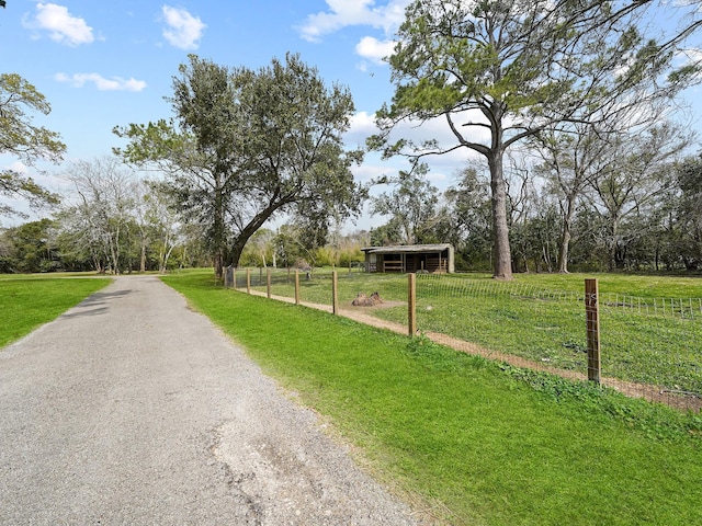 view of road with a rural view and a pole building