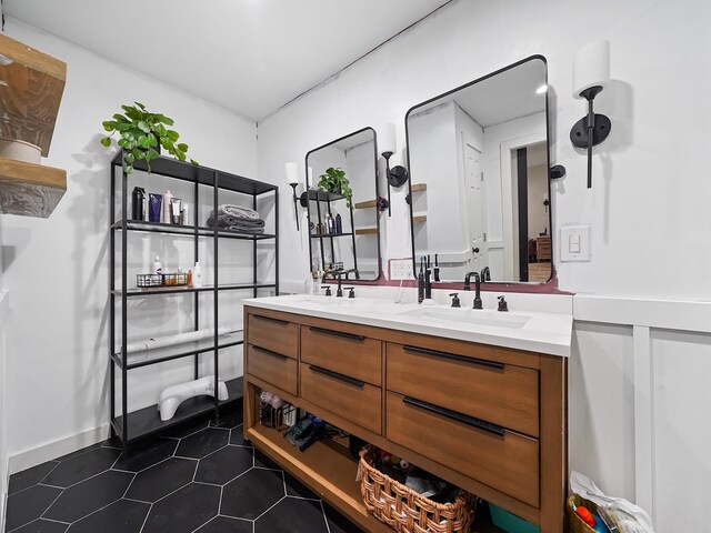 bathroom with double vanity and a sink