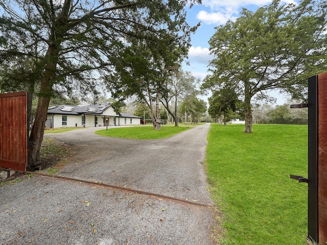 view of road with aphalt driveway