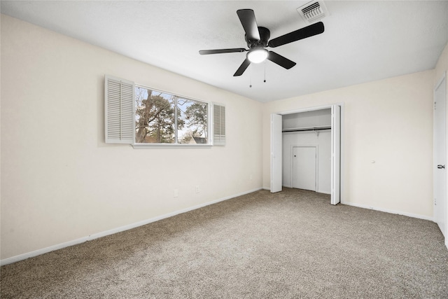 unfurnished bedroom featuring visible vents, baseboards, and carpet floors