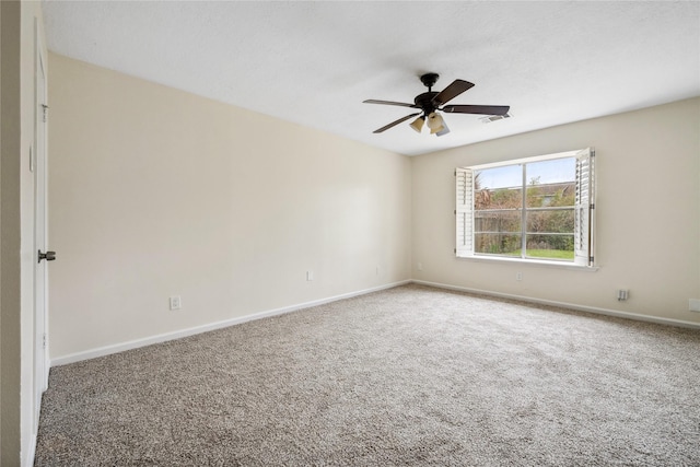 empty room featuring baseboards, visible vents, and carpet floors