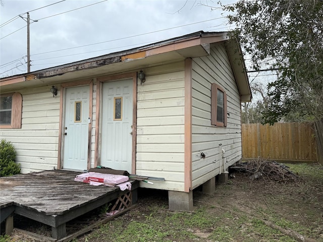 view of outbuilding with fence