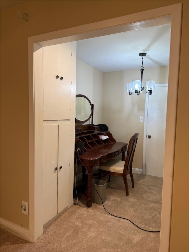 office area with light carpet and a chandelier