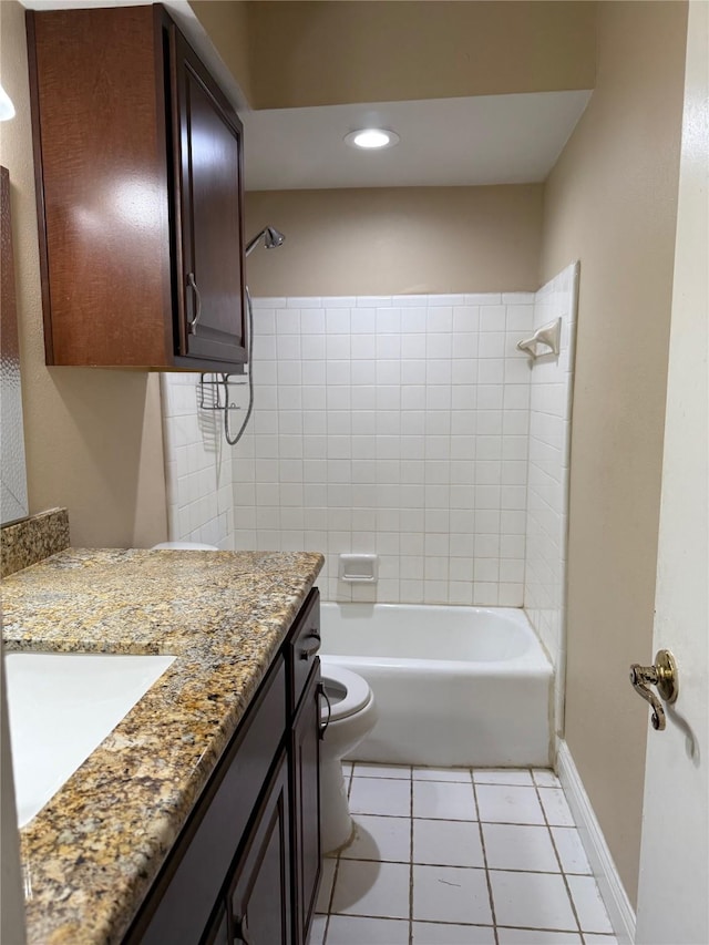 full bath with toilet, vanity, baseboards, and tile patterned floors