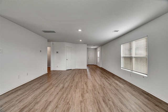 spare room featuring recessed lighting, baseboards, visible vents, and light wood finished floors