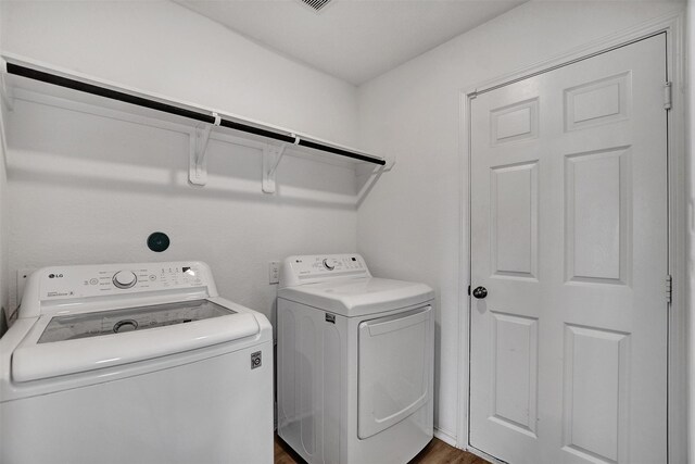 laundry room with laundry area and washer and clothes dryer