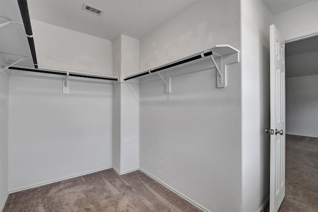 walk in closet featuring carpet and visible vents