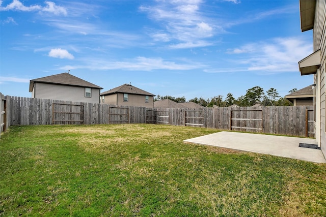 view of yard featuring a patio area and a fenced backyard