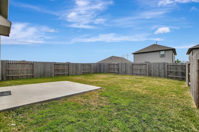 view of yard with a patio and a fenced backyard