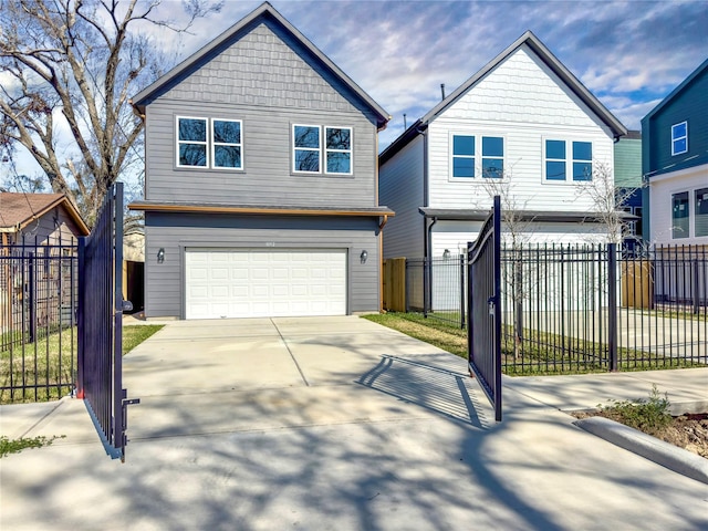 view of front of home featuring concrete driveway, fence, and an attached garage