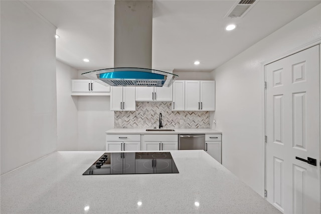 kitchen featuring visible vents, a sink, island range hood, dishwasher, and black electric cooktop