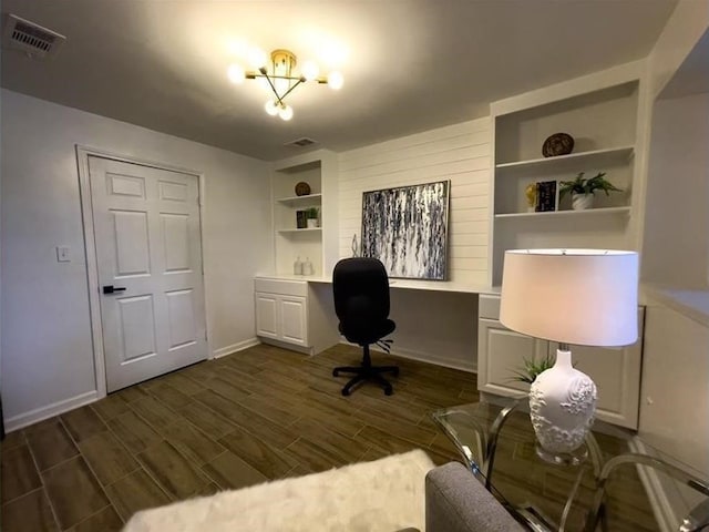 office space featuring dark wood-style flooring, visible vents, and baseboards