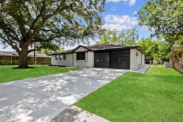 ranch-style home featuring a garage, brick siding, fence, and driveway