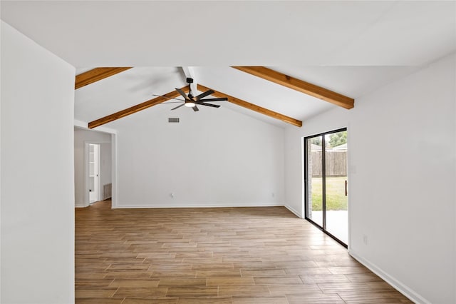 unfurnished room featuring a ceiling fan, light wood-type flooring, lofted ceiling with beams, and baseboards