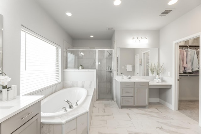 full bath featuring a garden tub, recessed lighting, visible vents, a shower stall, and vanity