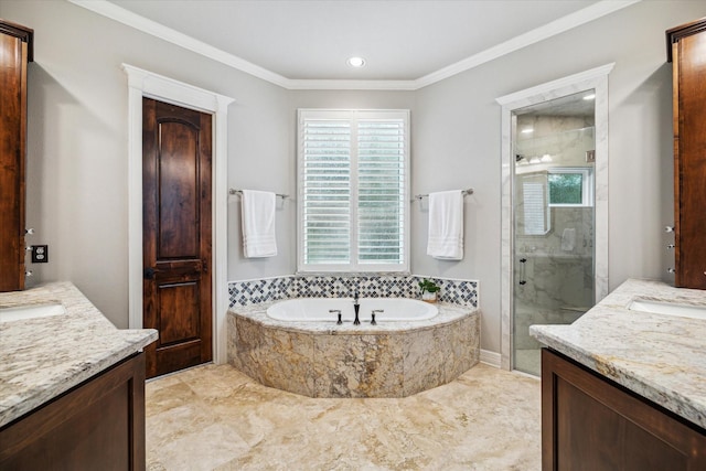 full bath with ornamental molding, a stall shower, two vanities, and a bath