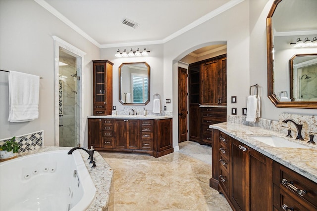 full bath featuring visible vents, ornamental molding, a sink, a shower stall, and two vanities