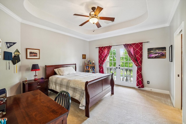 bedroom with light carpet, access to exterior, baseboards, and a raised ceiling