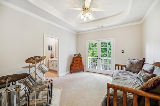 bedroom featuring access to exterior, a tray ceiling, french doors, light colored carpet, and visible vents