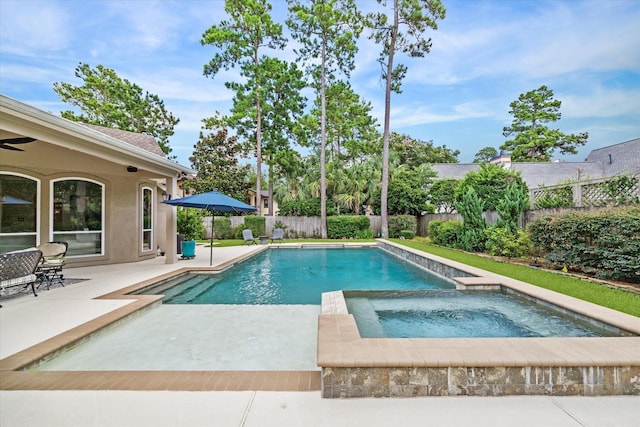 view of pool featuring a fenced in pool, a patio area, a fenced backyard, and an in ground hot tub