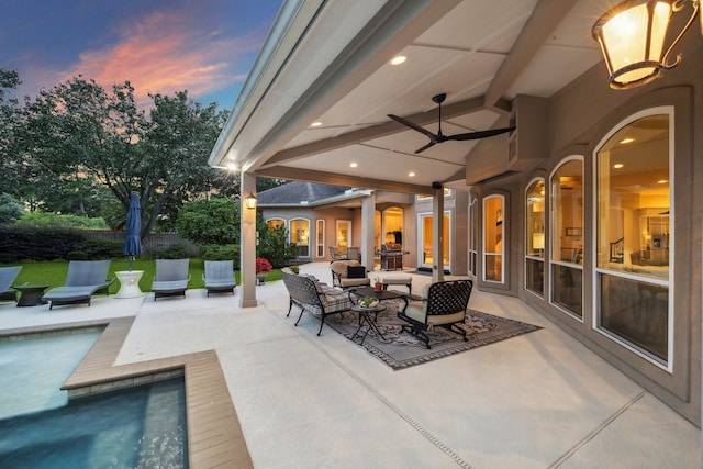 patio terrace at dusk with an outdoor pool