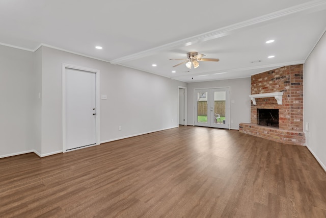 unfurnished living room featuring recessed lighting, a fireplace, crown molding, and wood finished floors