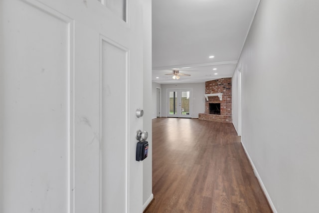 hallway with recessed lighting, baseboards, and wood finished floors