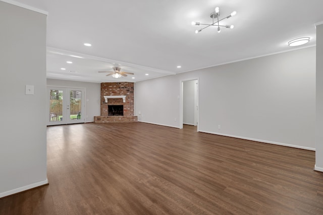 unfurnished living room featuring a ceiling fan, dark wood-style floors, baseboards, recessed lighting, and a brick fireplace