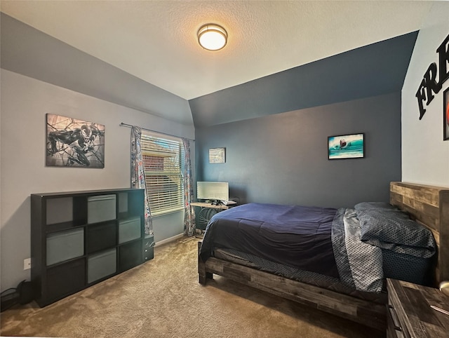 carpeted bedroom with lofted ceiling and baseboards