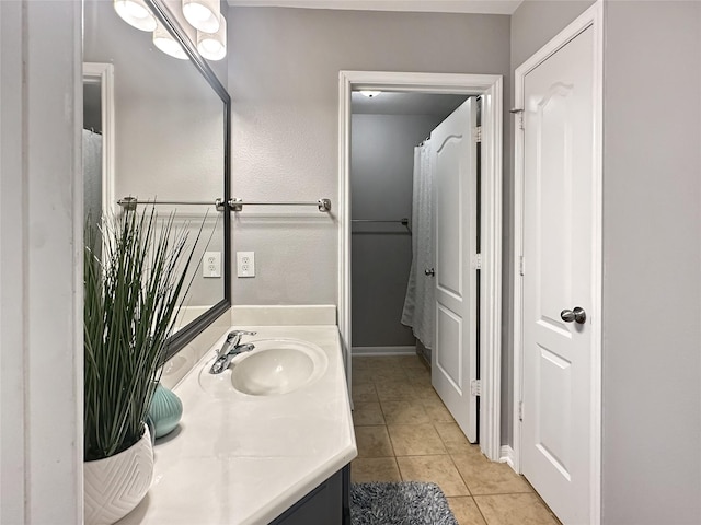 bathroom featuring tile patterned floors and vanity