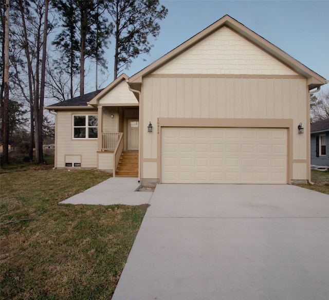 ranch-style house featuring concrete driveway, an attached garage, and a front yard