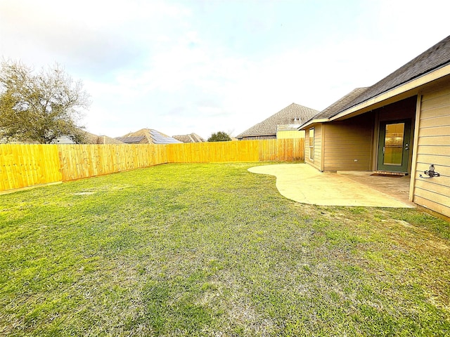 view of yard with a fenced backyard and a patio