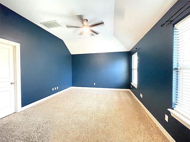 bonus room with lofted ceiling, ceiling fan, visible vents, baseboards, and carpet