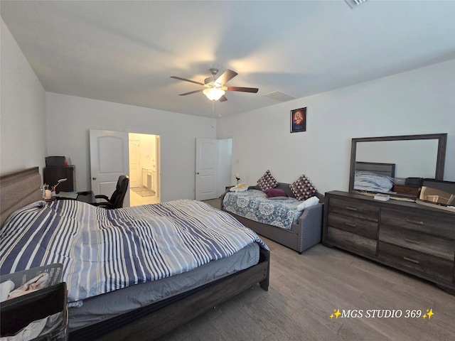 bedroom featuring visible vents, a ceiling fan, and wood finished floors