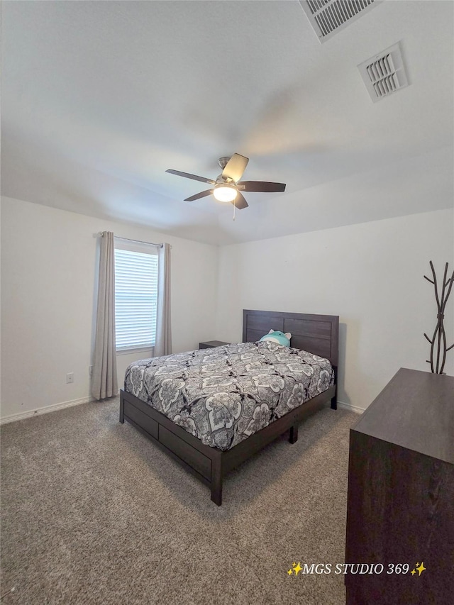 bedroom with baseboards, visible vents, and carpet
