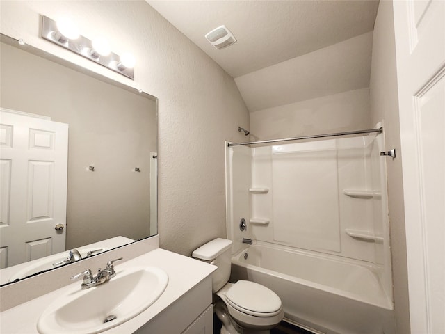 full bathroom featuring visible vents, a textured wall, toilet, vaulted ceiling, and vanity