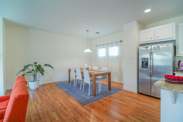 dining area featuring recessed lighting, visible vents, light wood-type flooring, and baseboards