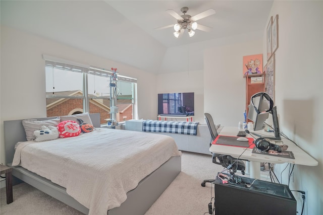 carpeted bedroom featuring ceiling fan and vaulted ceiling