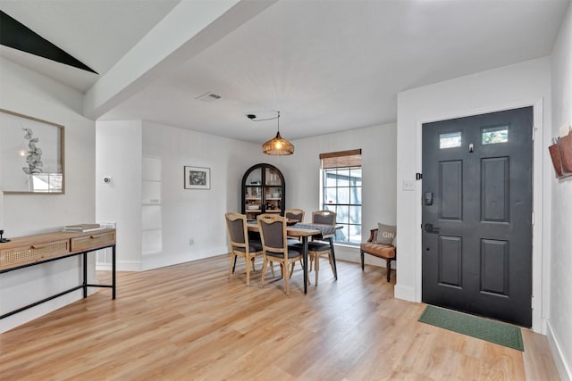 foyer with visible vents, baseboards, and light wood-style floors