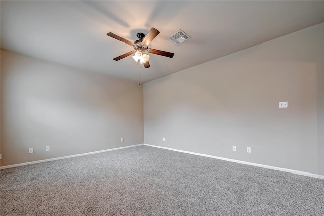 unfurnished room with ceiling fan, carpet flooring, visible vents, and baseboards