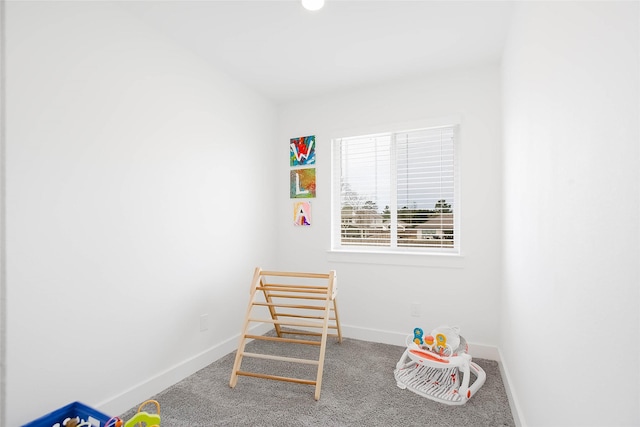 game room with carpet floors and baseboards