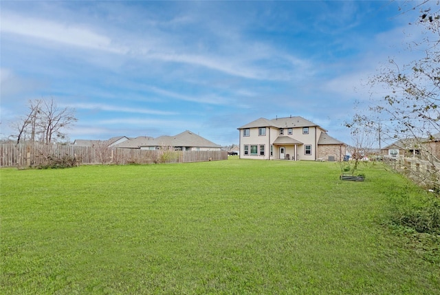 view of yard with fence