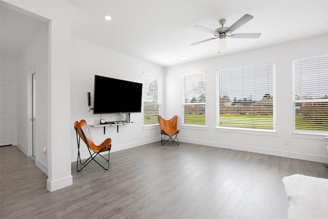 unfurnished room with a ceiling fan, baseboards, wood finished floors, and recessed lighting