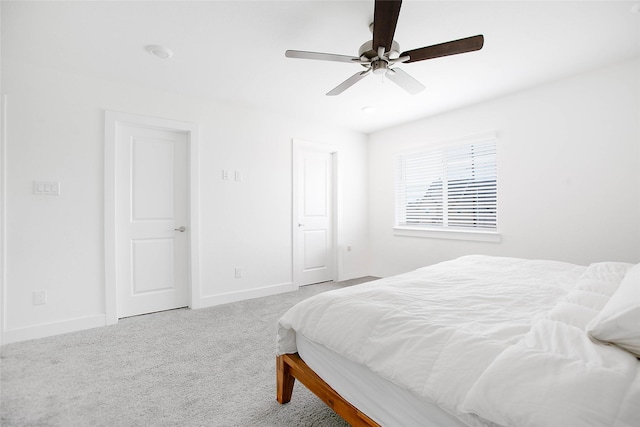 bedroom featuring a ceiling fan, carpet flooring, and baseboards