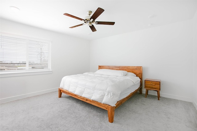 bedroom featuring ceiling fan, carpet floors, and baseboards