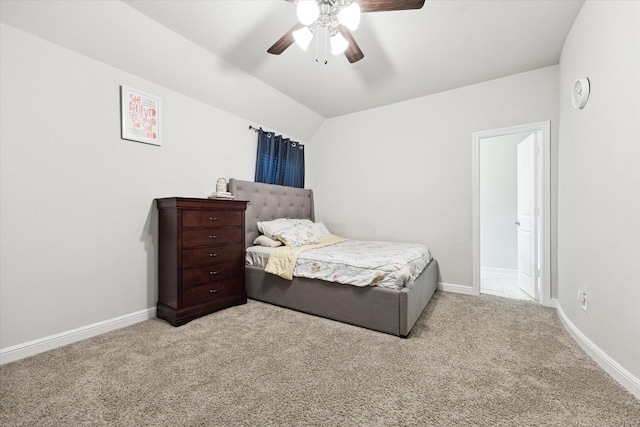 bedroom featuring lofted ceiling, carpet, and baseboards