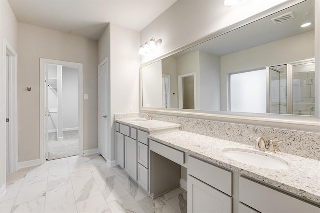 full bathroom featuring a sink, visible vents, marble finish floor, double vanity, and a stall shower