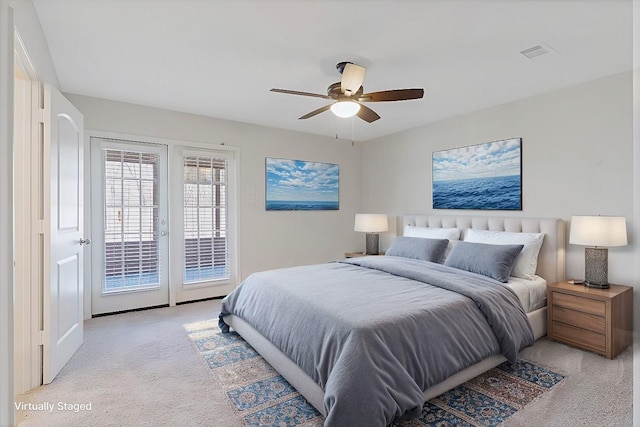 bedroom with light carpet, visible vents, a ceiling fan, access to outside, and french doors