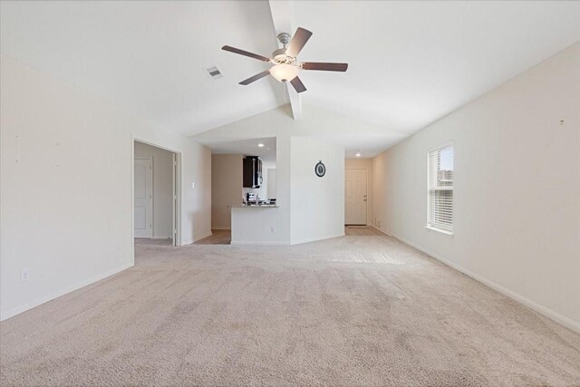 interior space with light carpet, baseboards, visible vents, lofted ceiling with beams, and ceiling fan