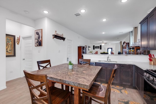 dining area with a ceiling fan, recessed lighting, visible vents, and light wood finished floors